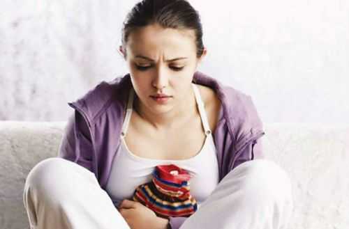 Грелка при боли в животе